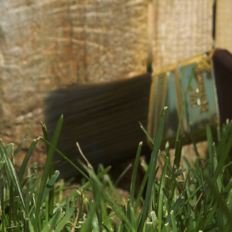 Resealing fence post with brush